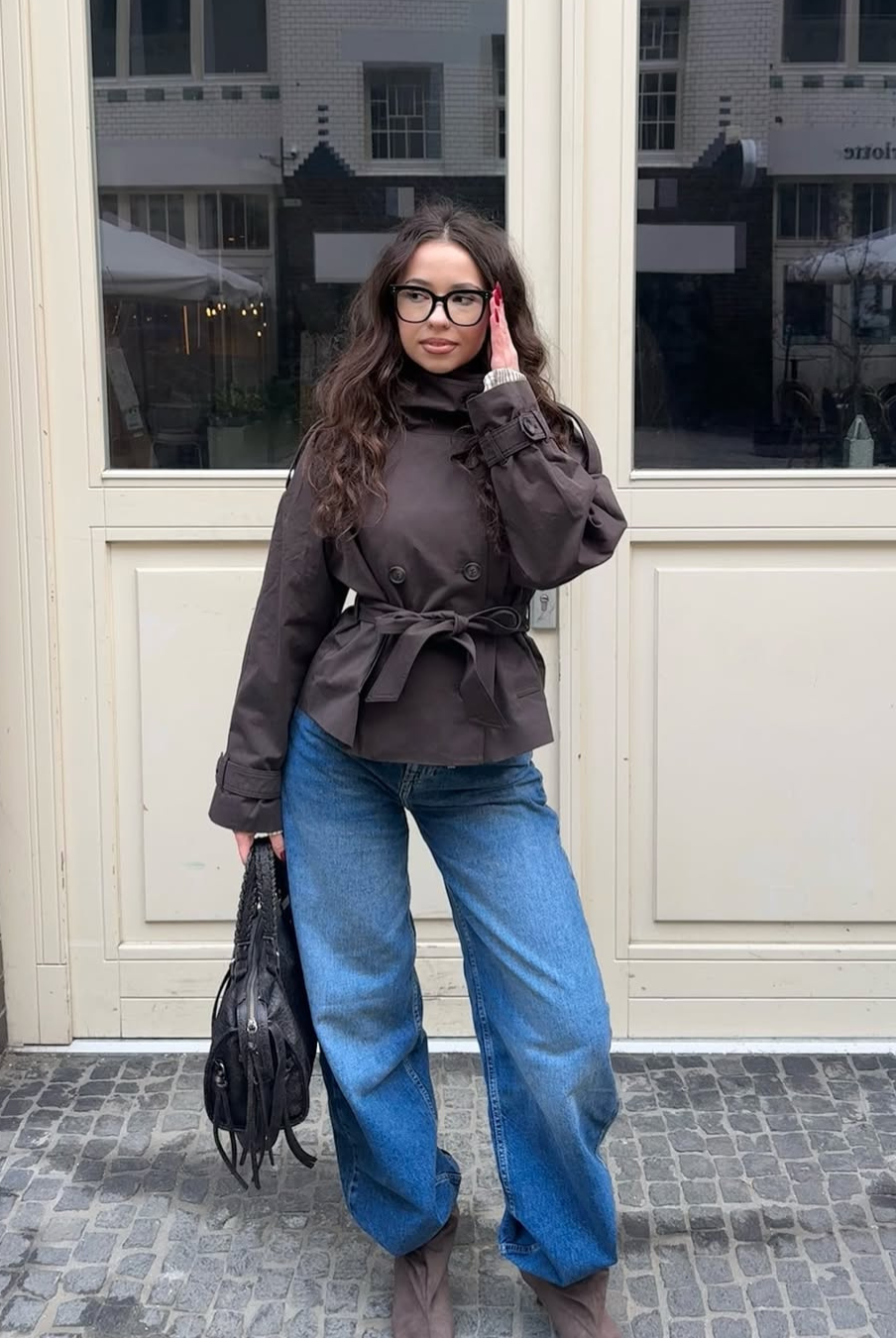 Brown short trench coat with belted waist, full length front view