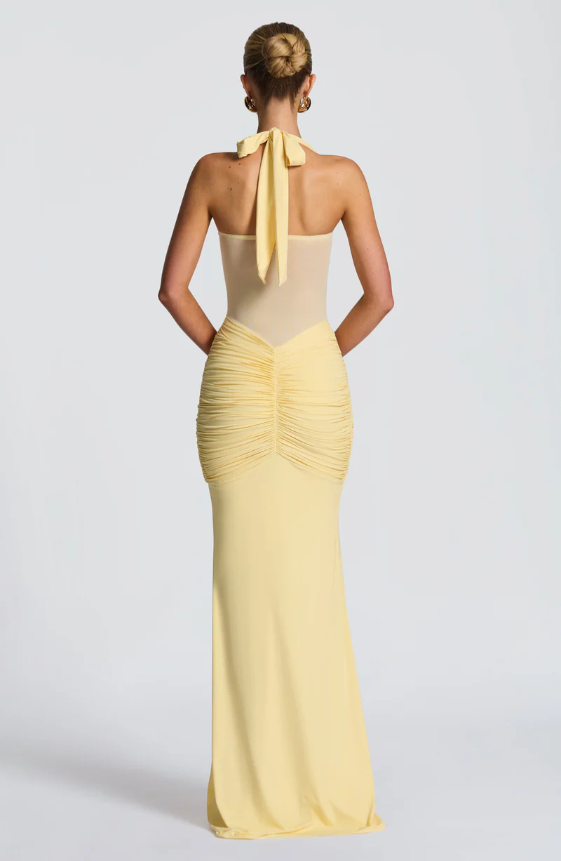 Lemon halter neck maxi dress with bow tie neck, back view on model