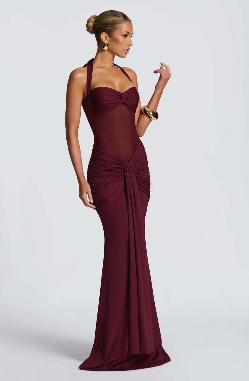 Wine halter neck maxi dress with ruched skirt, side view on model