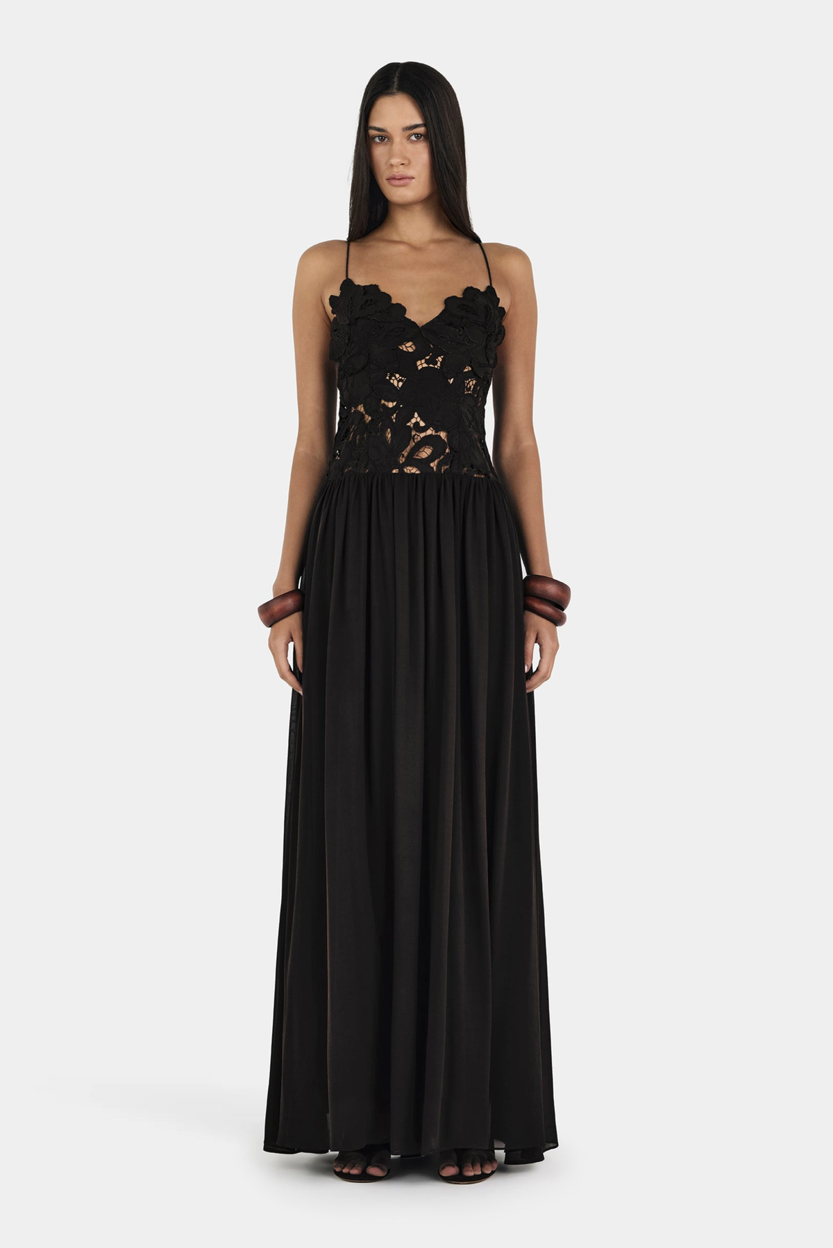 Black lace maxi dress with floral bodice, close front view on model