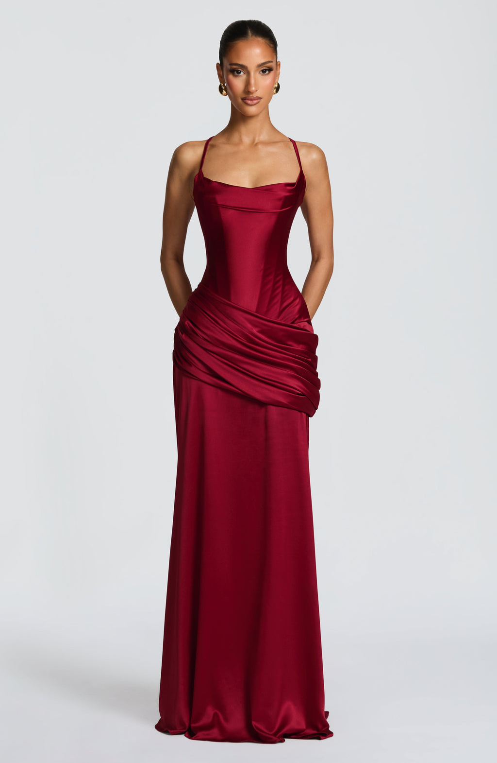 Burgundy satin gown, front view with hands behind back