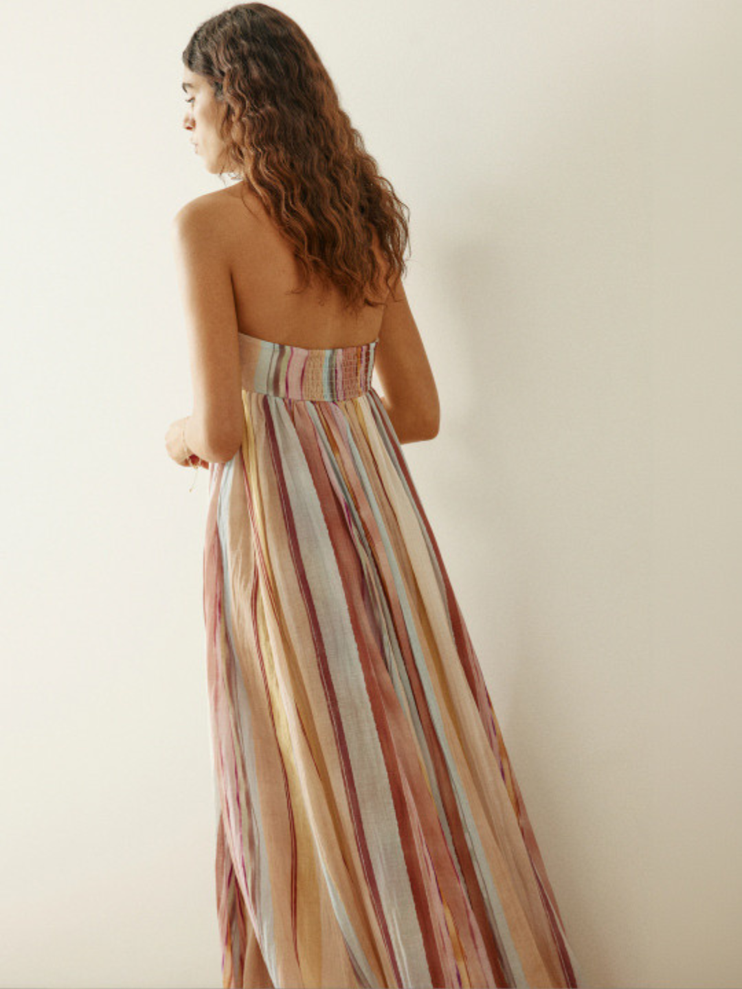 Strapless maxi dress in pink and blue stripes, back view on model
