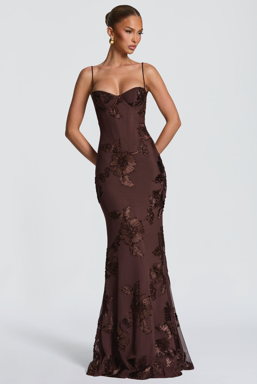 Mocha brown fitted maxi dress with floral lace embroidery, side view on model