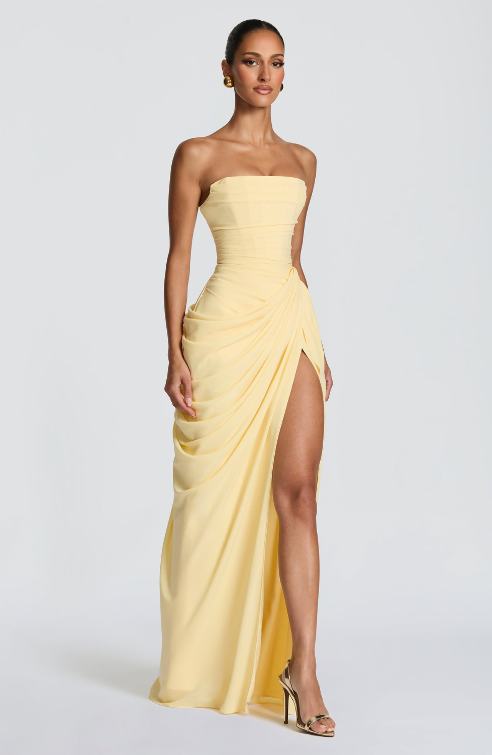 Lemon strapless maxi dress with thigh-high split, side view on model