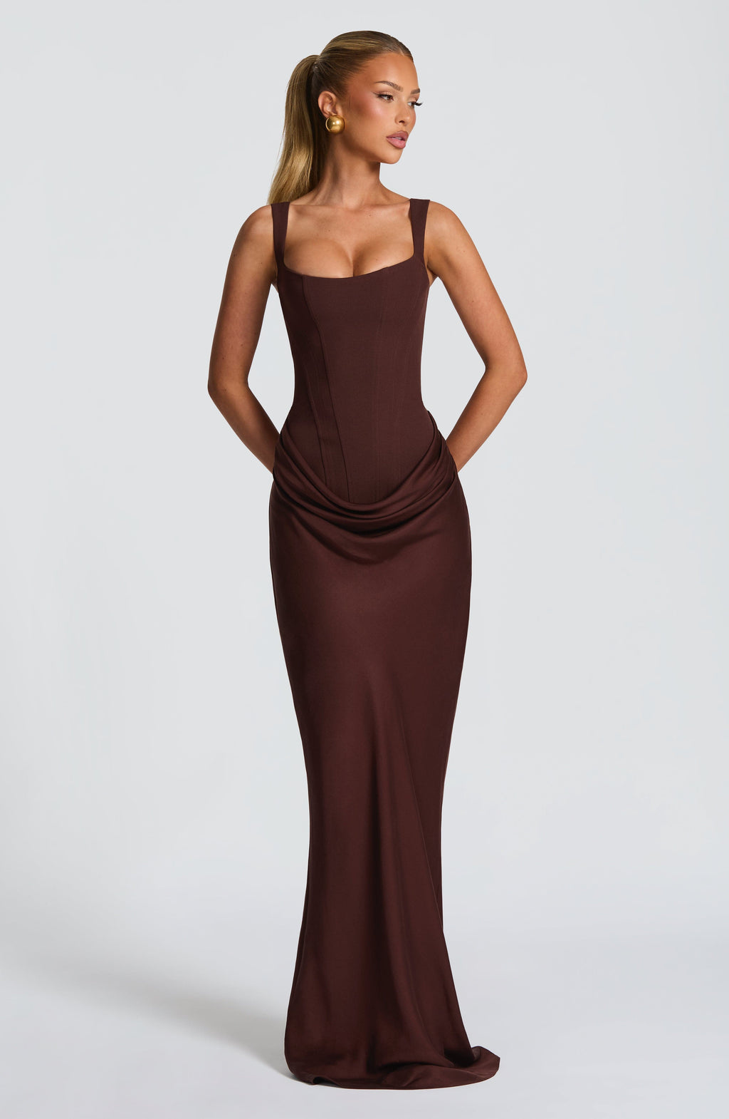 Mocha corset-style maxi dress, front view hands behind back