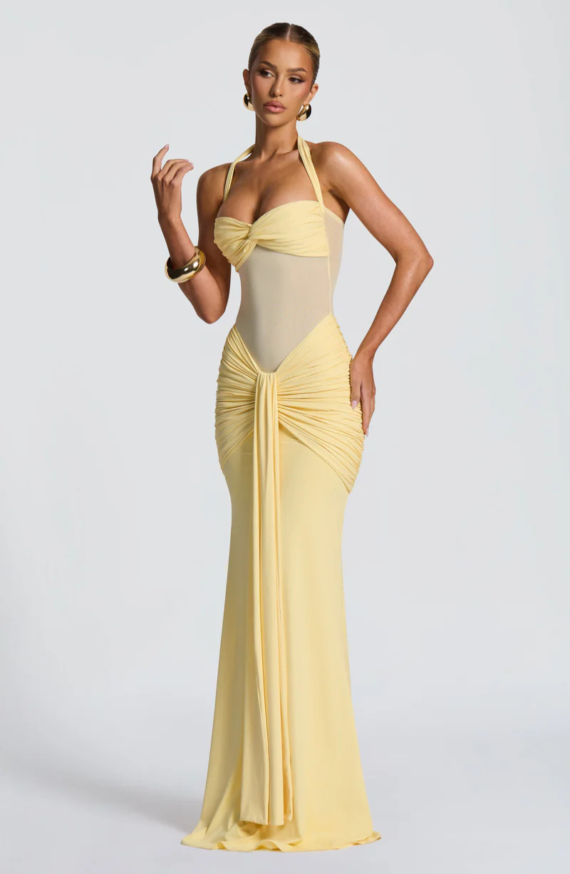 Lemon halter neck maxi dress, front view with hand raised