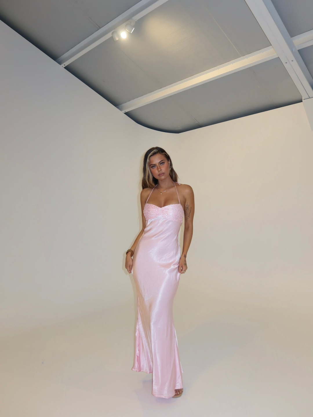 Pink satin slip maxi dress with lace bodice, front view on model