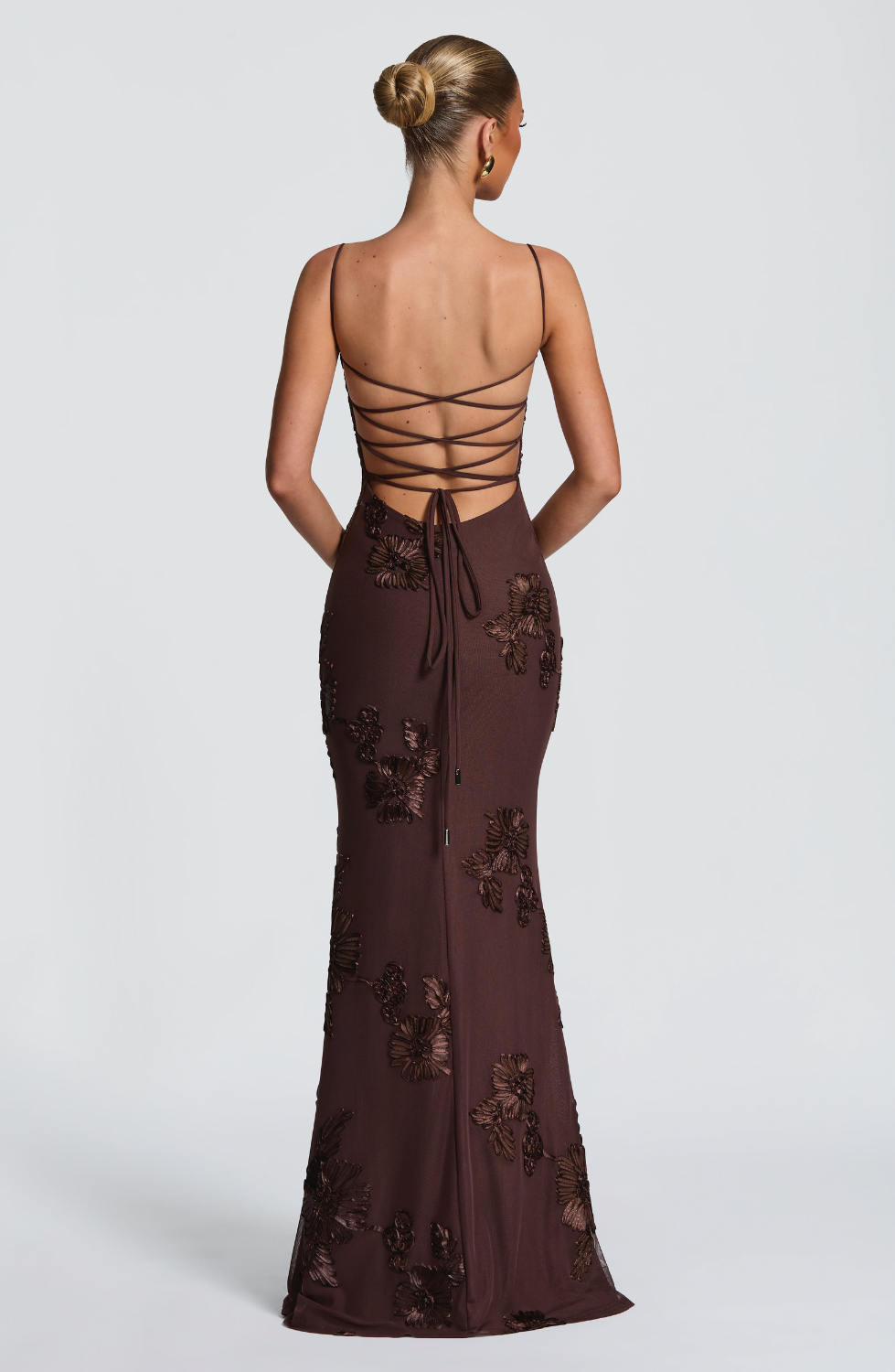 Mocha brown fitted maxi dress with lace-up open back, back view on model