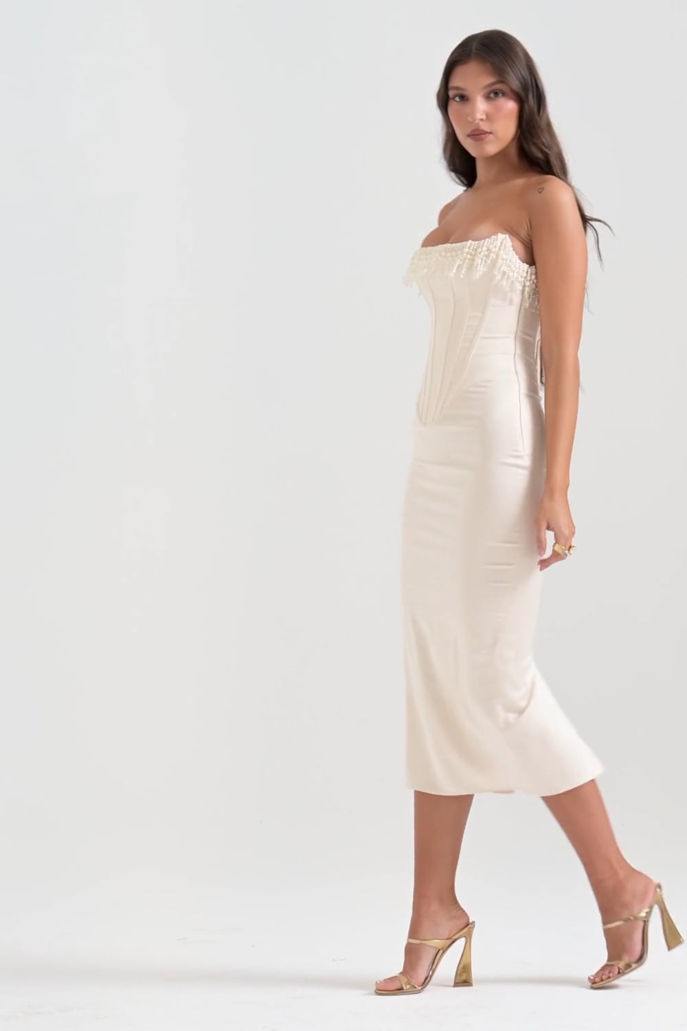 Ivory beaded-fringe corset midi dress, full side view walking