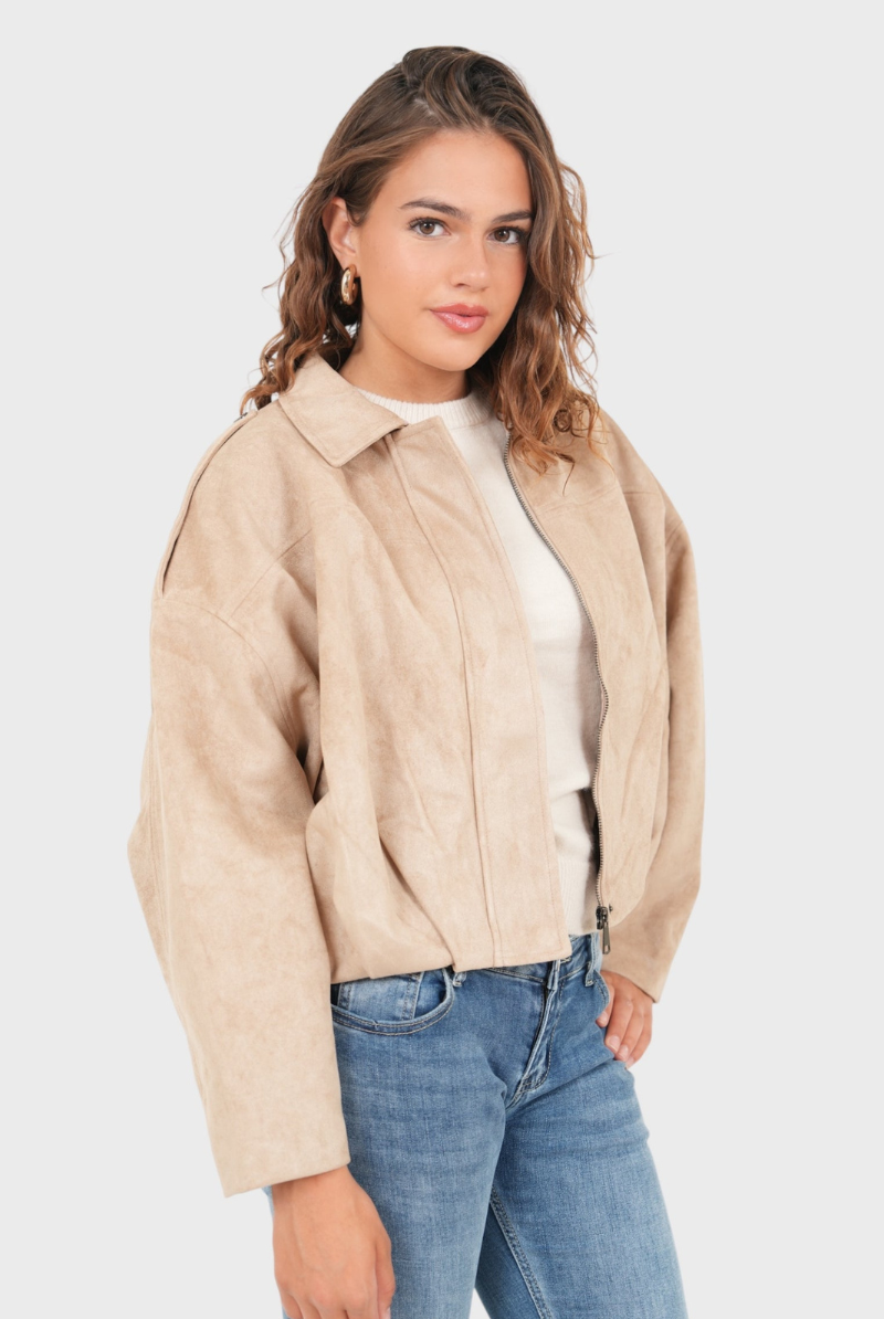 Beige suede bomber jacket, side view on model