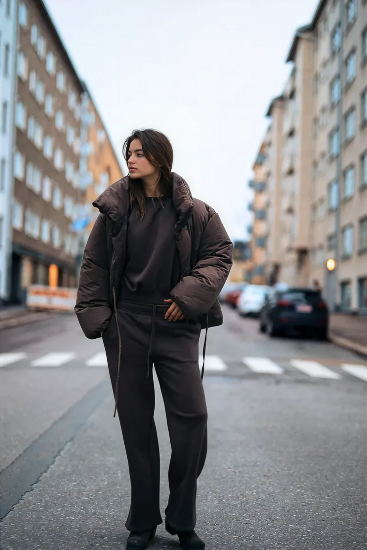 Brown wrap puffer jacket on model, front view on street