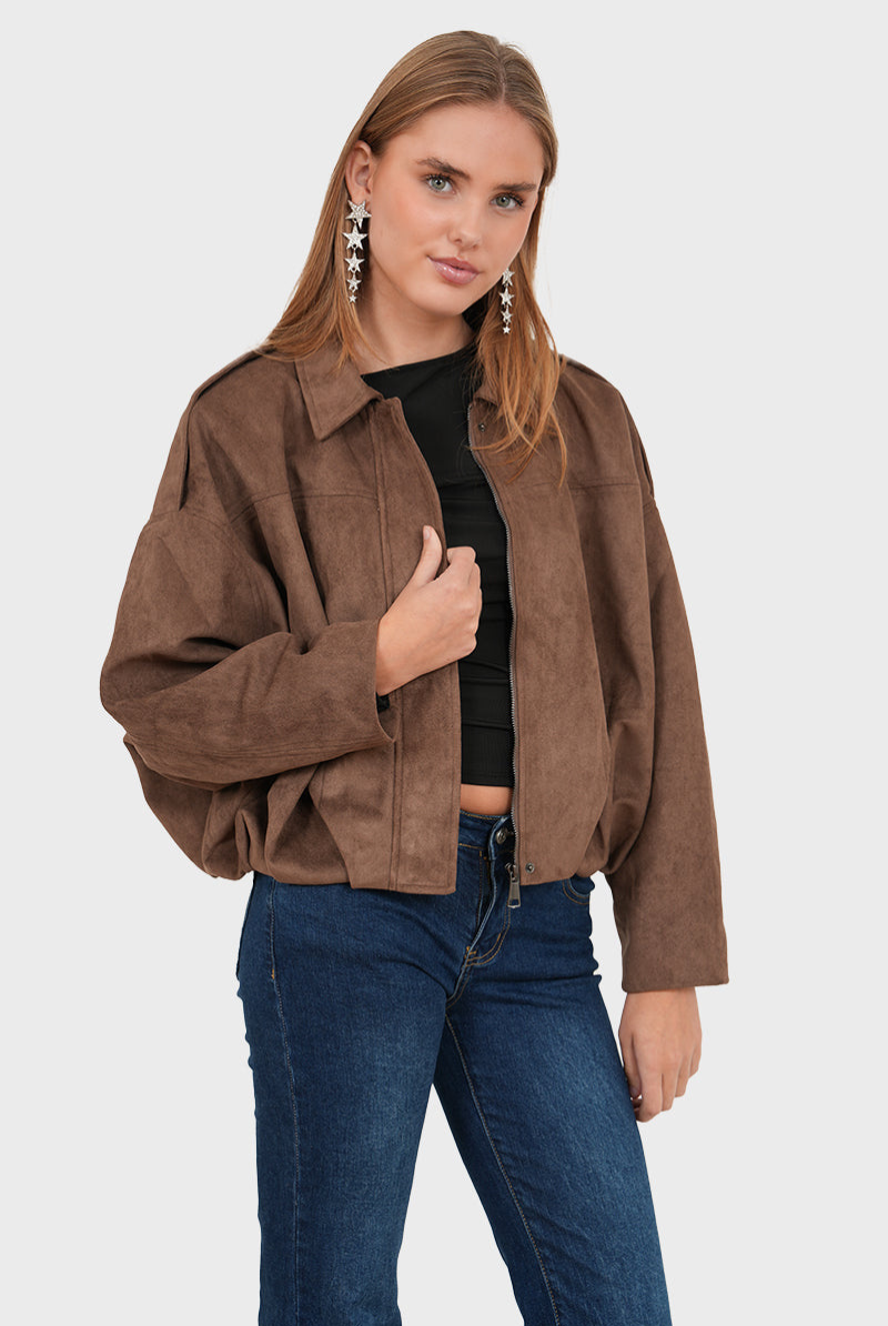 Coffee brown suede bomber jacket, front view with hand on zip
