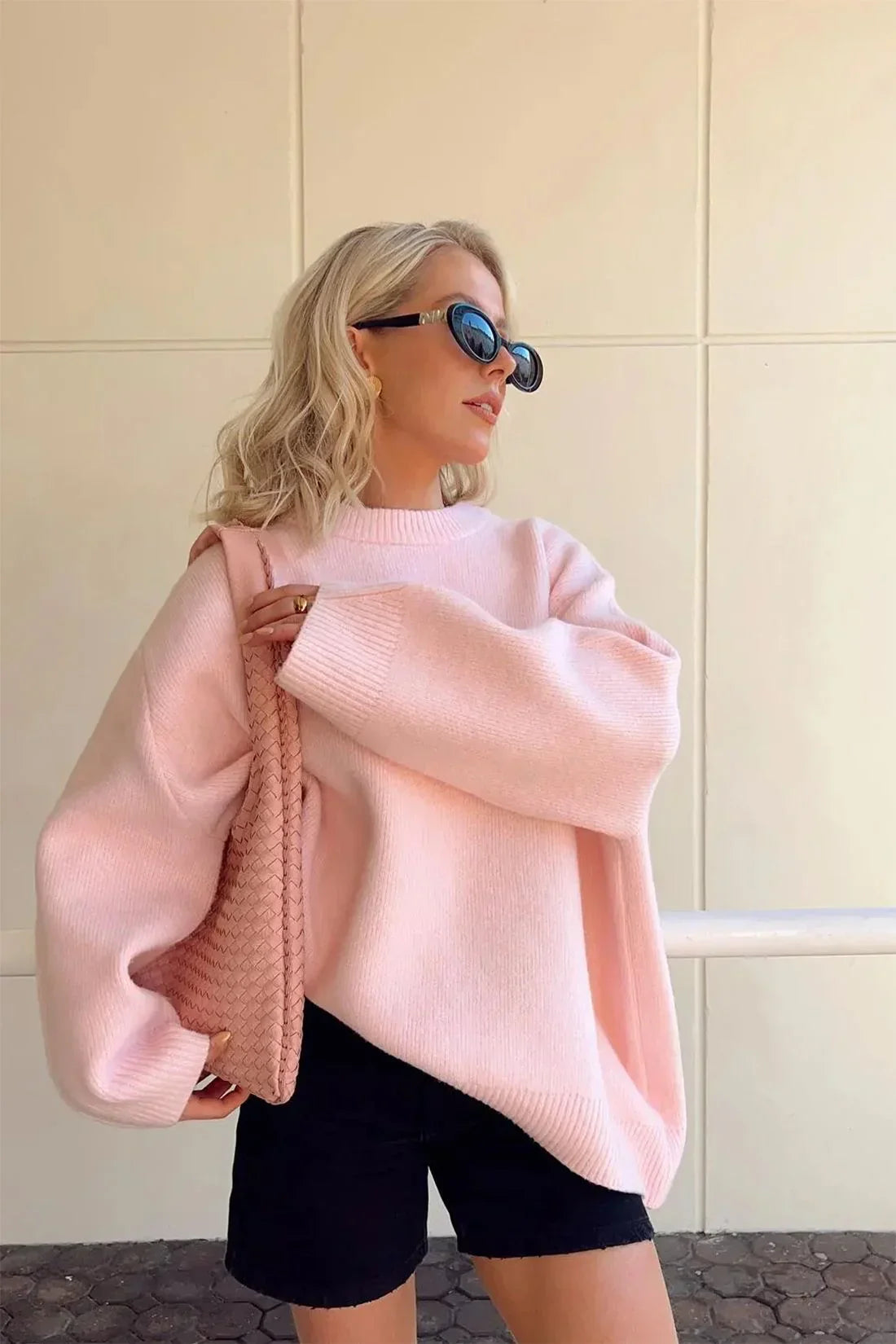Pink oversized crewneck jumper, front view on model