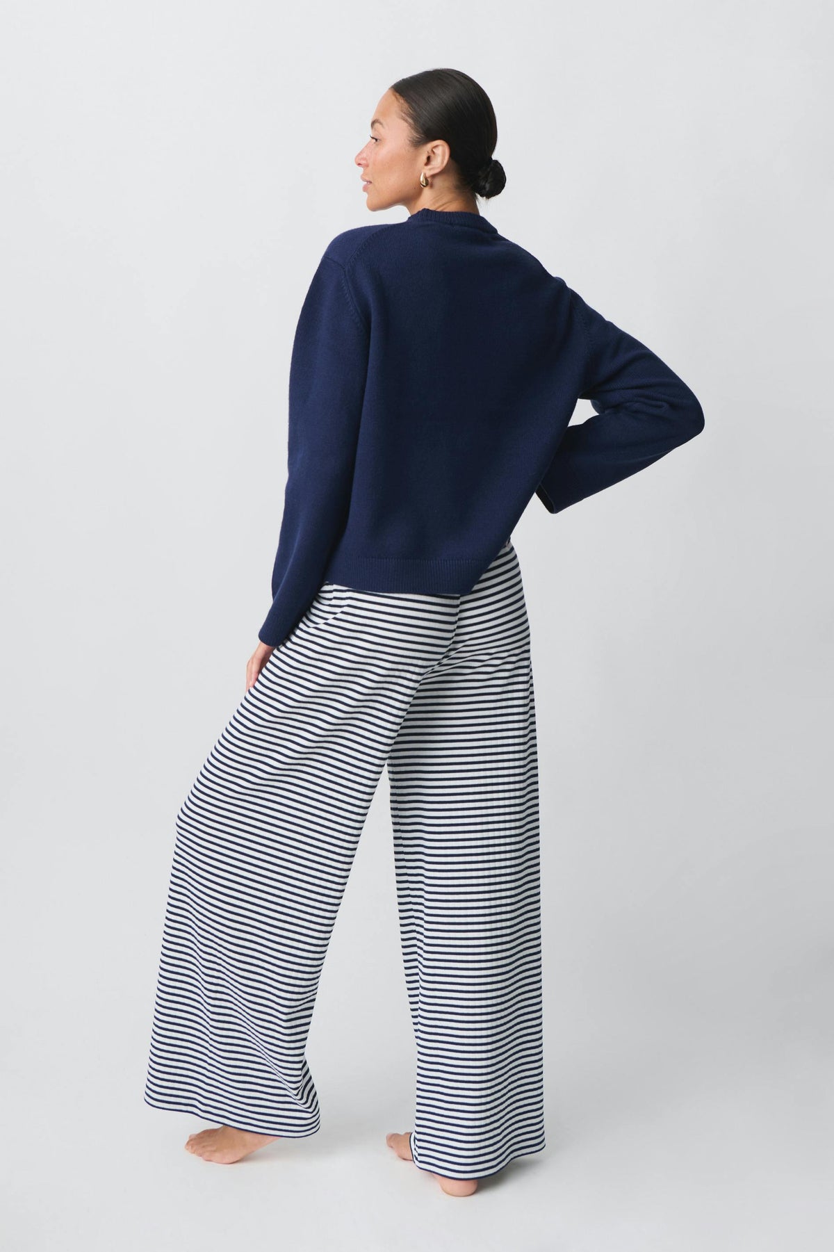 Navy and white striped wide-leg trousers, back view on model