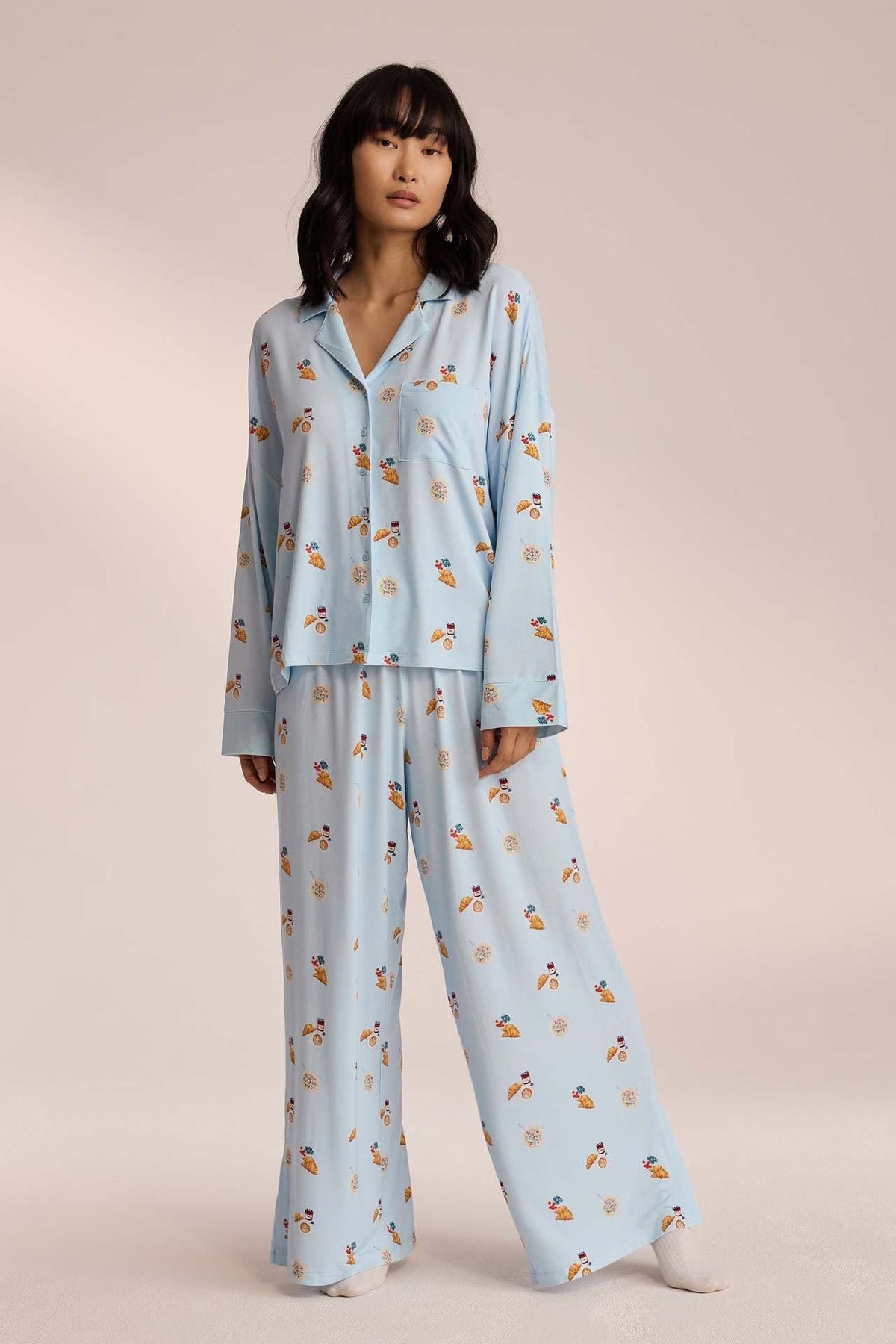 Light blue breakfast-print pyjama set with trousers, front view