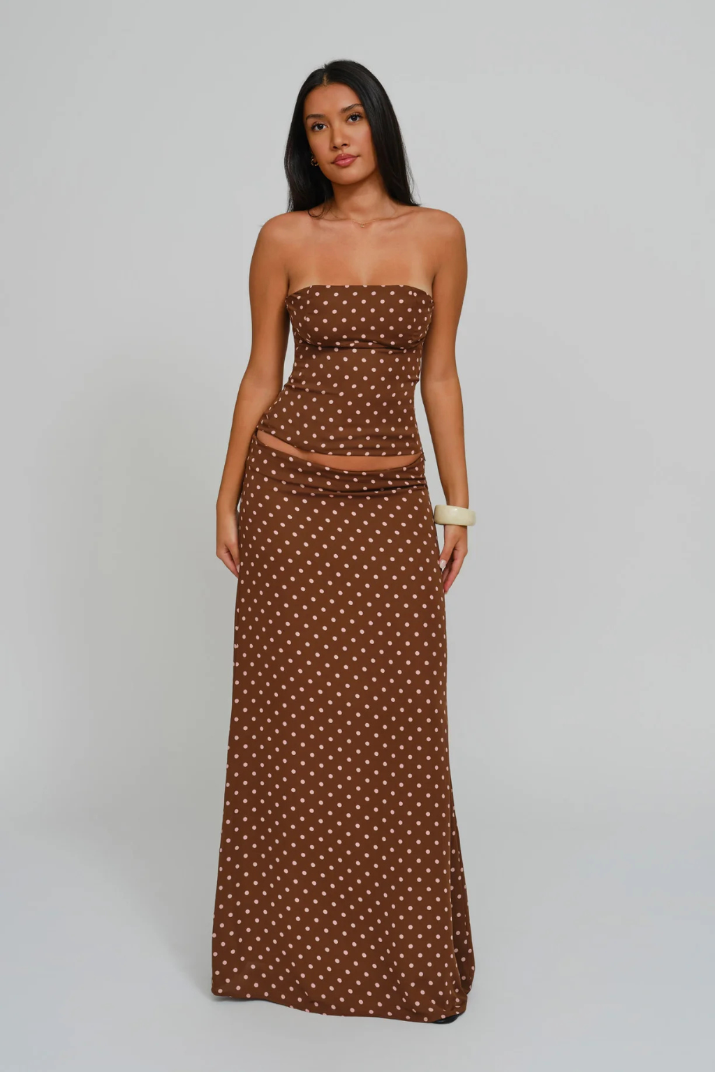 Cocoa dot corset top and wrap maxi skirt, front view on model