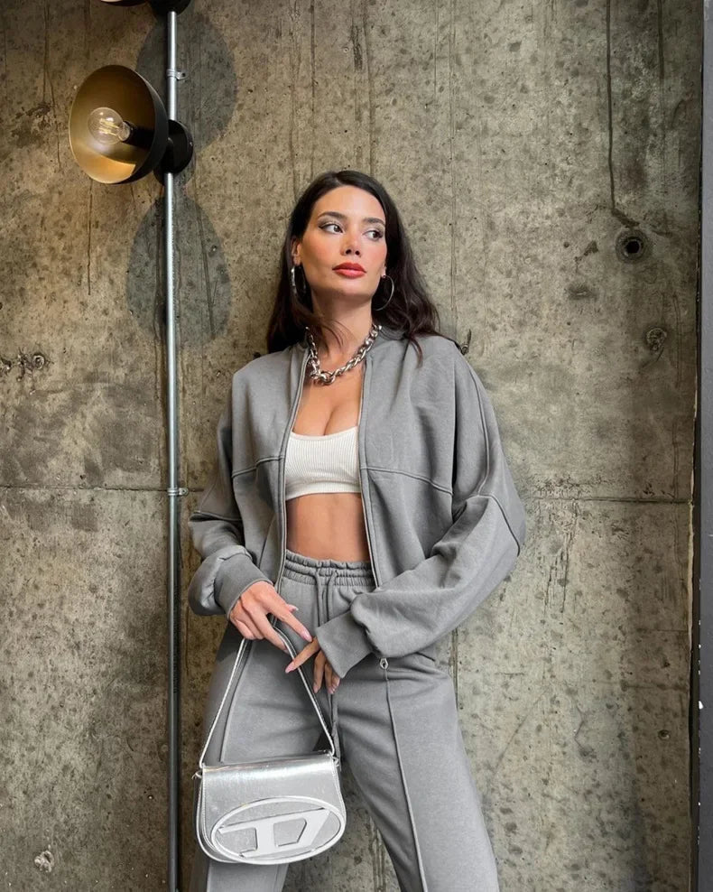 Grey oversized zip-up hoodie and joggers set, front view on model