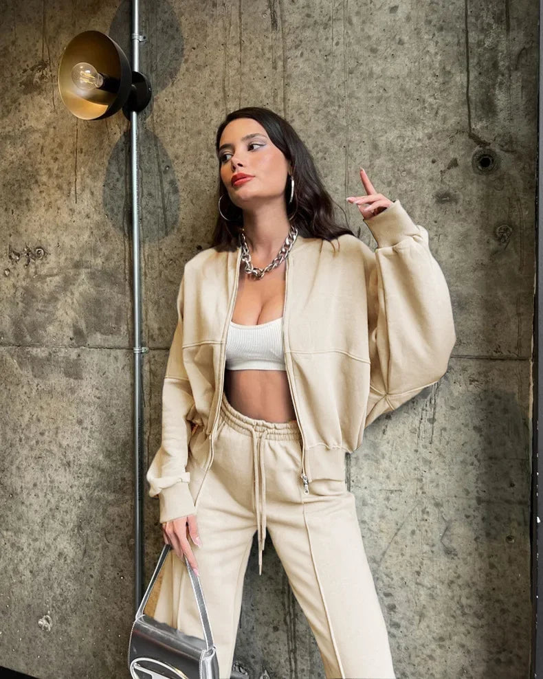 Beige oversized zip-up hoodie and joggers set, front view on model
