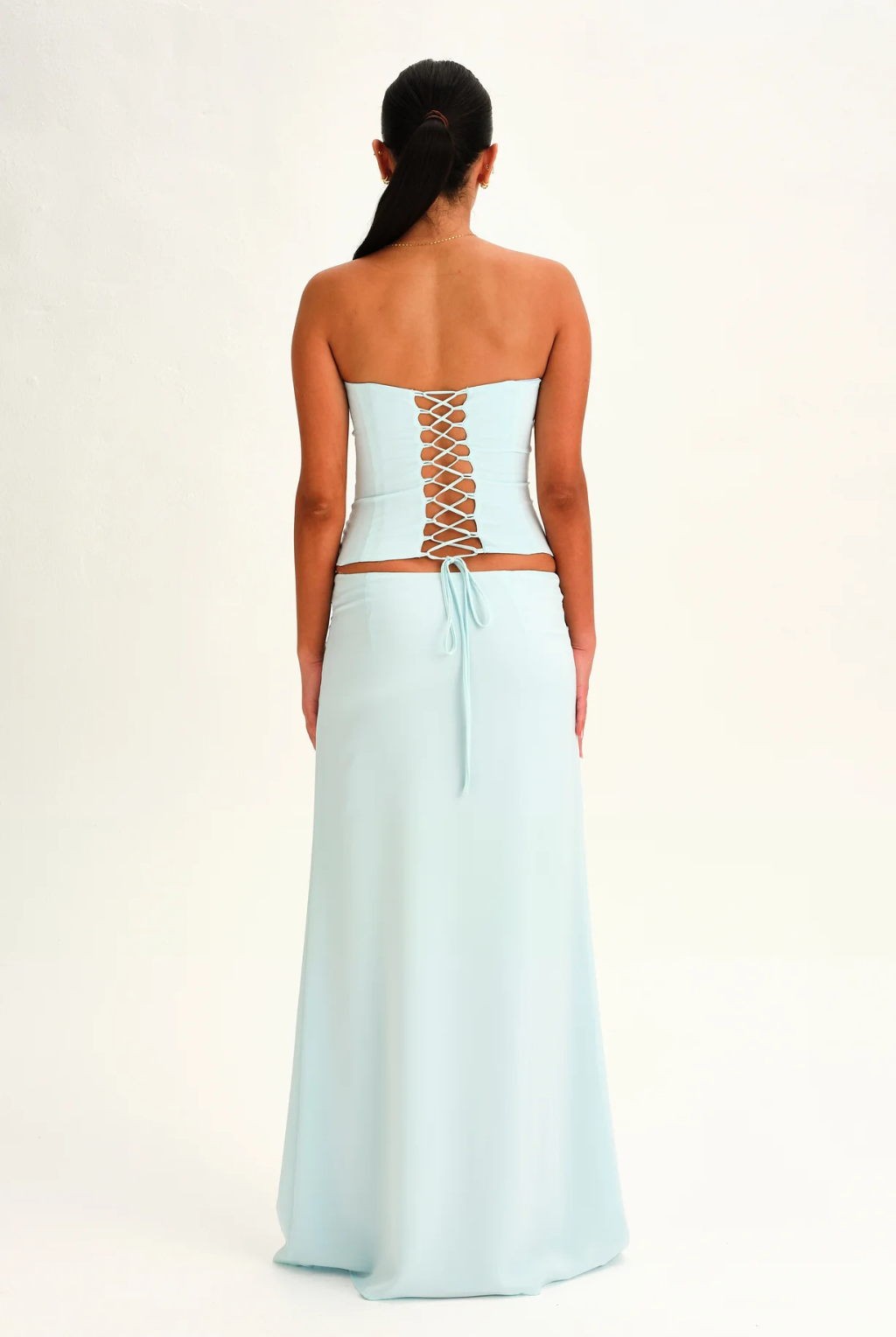 Mist blue lace-up corset top and wrap maxi skirt, back view on model