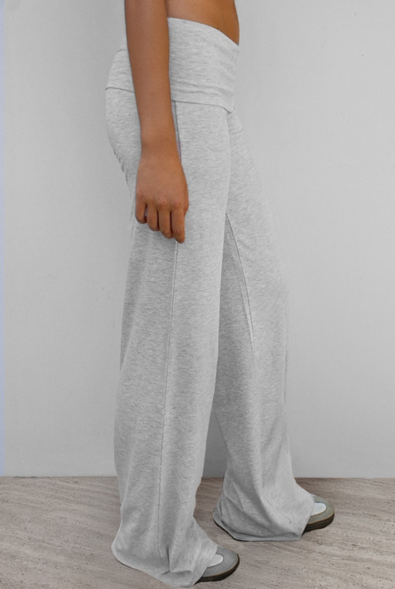 Grey wide-leg joggers with fold-over waistband, side view on model