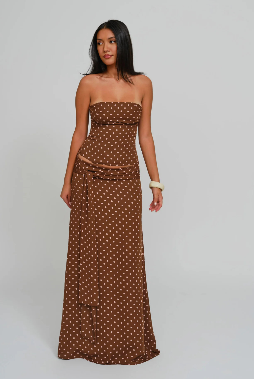 Cocoa dot corset top and wrap maxi skirt, side view on model