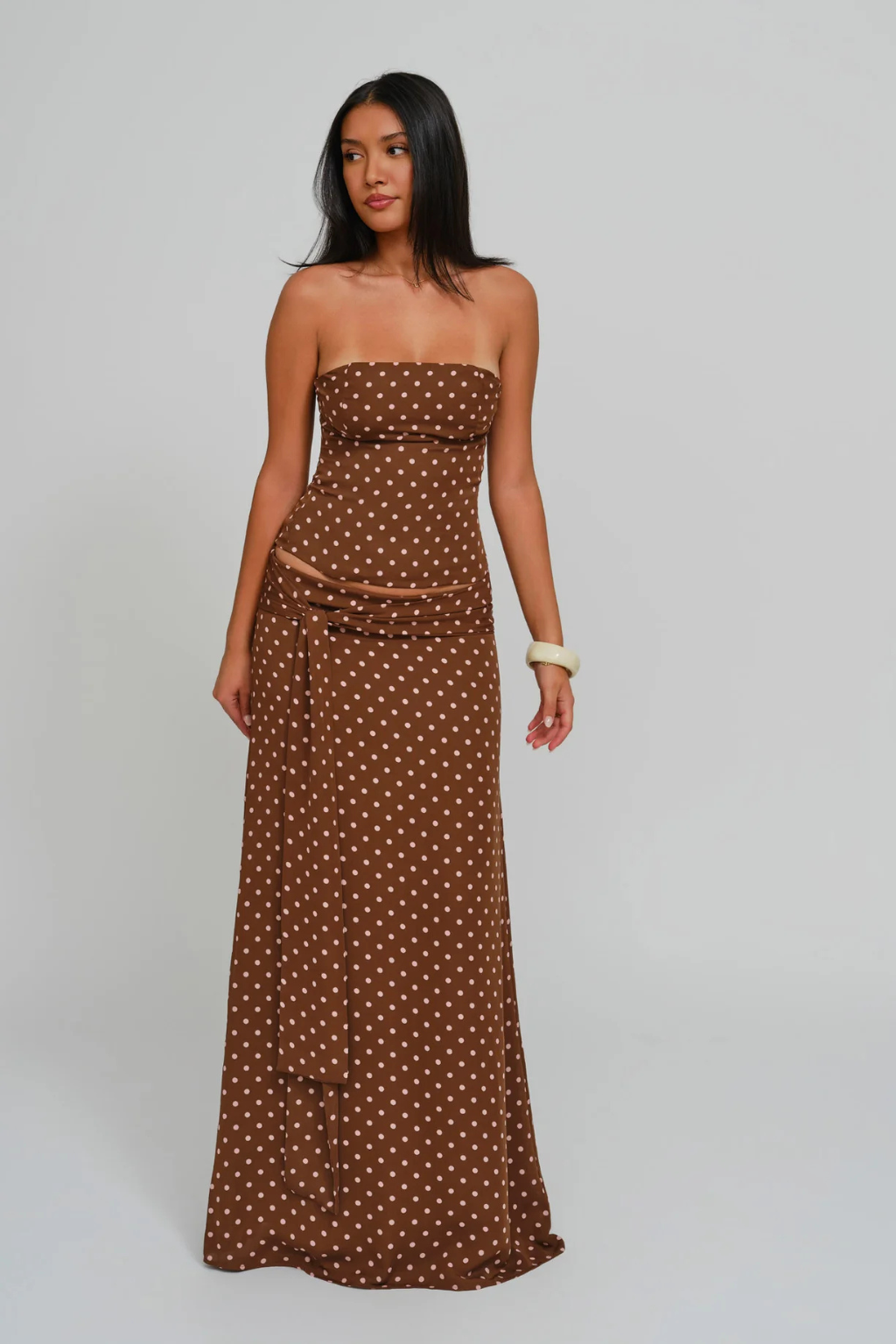 Cocoa dot corset top and wrap maxi skirt, side view on model