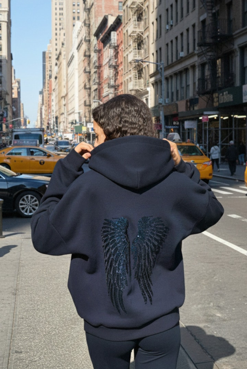 Navy hoodie and joggers with tonal sequin wings, back view on model