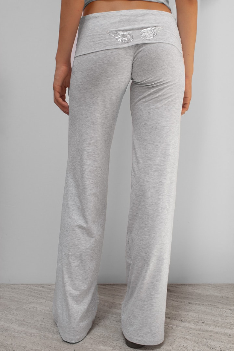 Grey joggers with sequin wing detail on waistband, back view on model