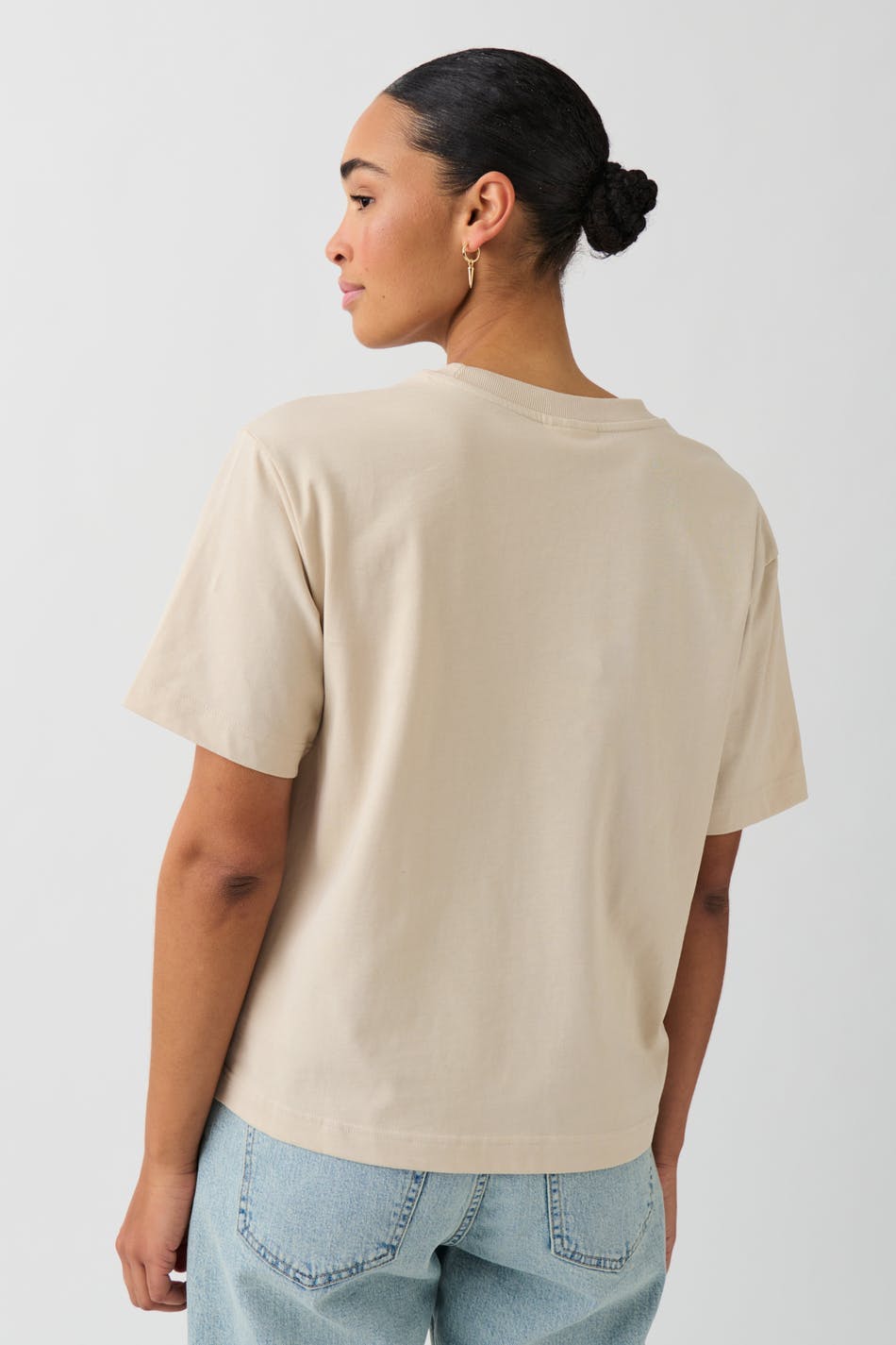 Warm sand cotton crew neck t-shirt, back view on model