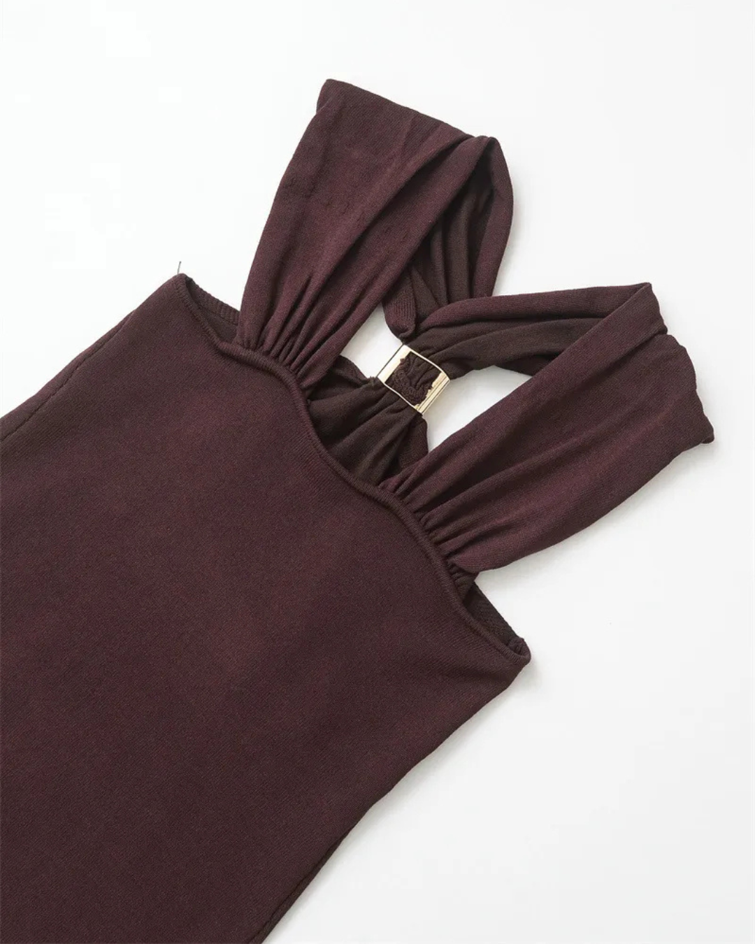 Close-up of the gold hardware on burgundy halter top