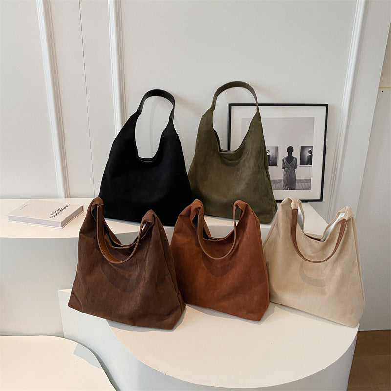 Suede shoulder tote bags in five colours displayed together