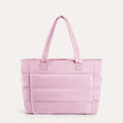 Pink quilted puffer tote bag, front view on plain background