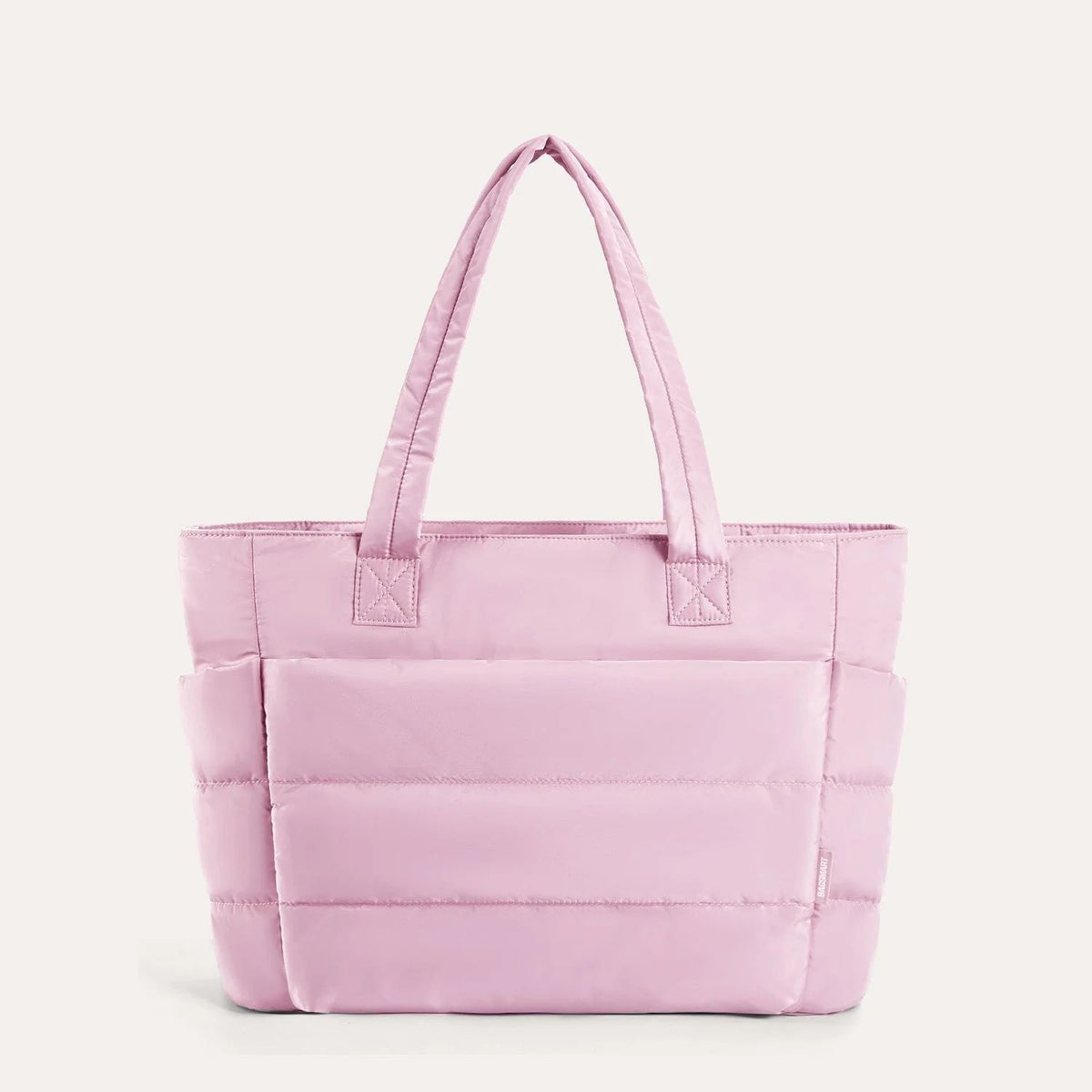 Pink quilted puffer tote bag, front view on plain background