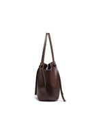 Dark brown leather tote bag, side view on white background