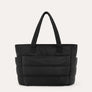 Black quilted puffer tote bag, front view on plain background