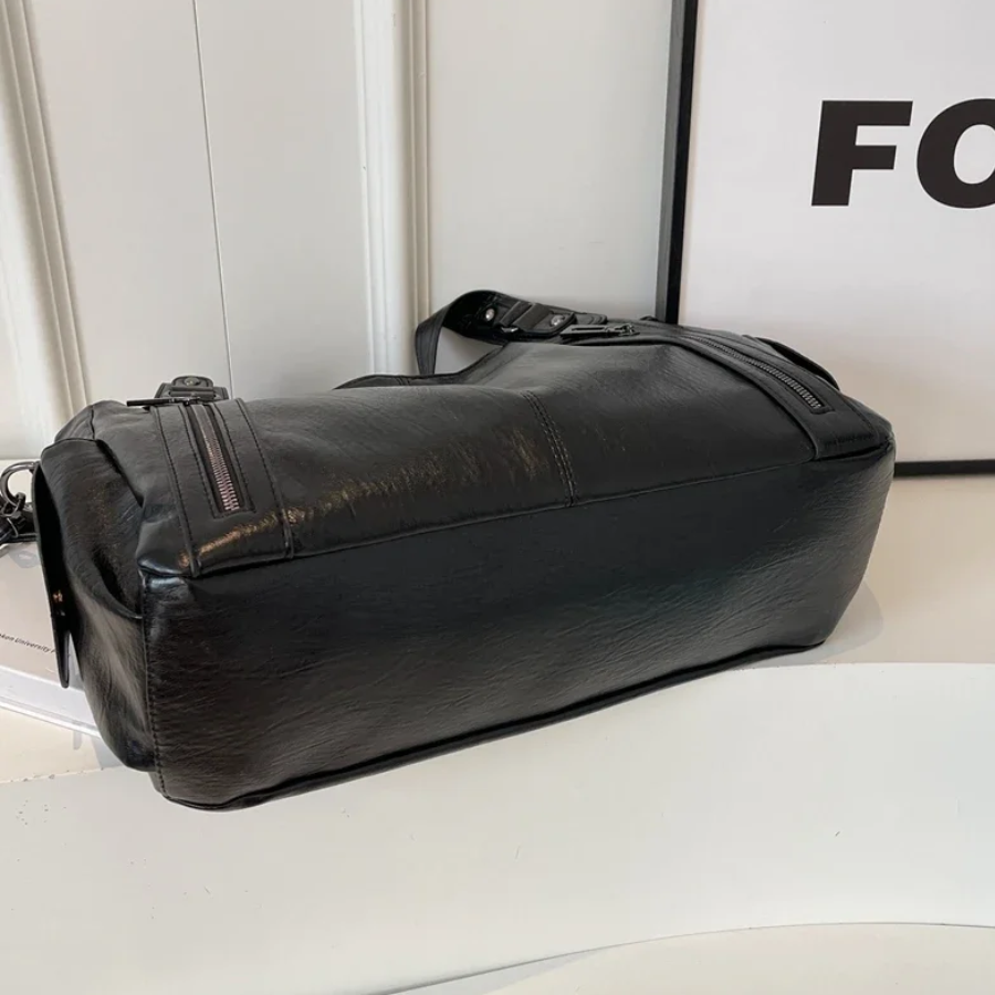 Midnight black leather shoulder bag, base and side seam view