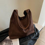 Dark brown suede shoulder tote bag with leather handle
