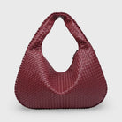 Burgundy woven leather hobo bag, front view on plain background
