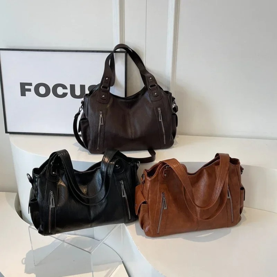 Leather shoulder bags in espresso brown, black and cognac tan