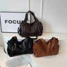 Leather shoulder bags in espresso brown, black and cognac tan
