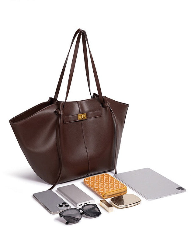 Chocolate brown leather tote bag with phone, sunglasses and tablet laid out