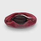 Burgundy woven leather hobo bag with zip open, top-down view