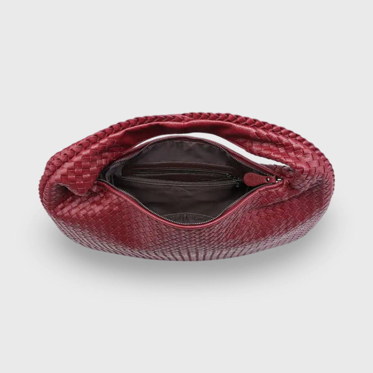 Burgundy woven leather hobo bag with zip open, top-down view