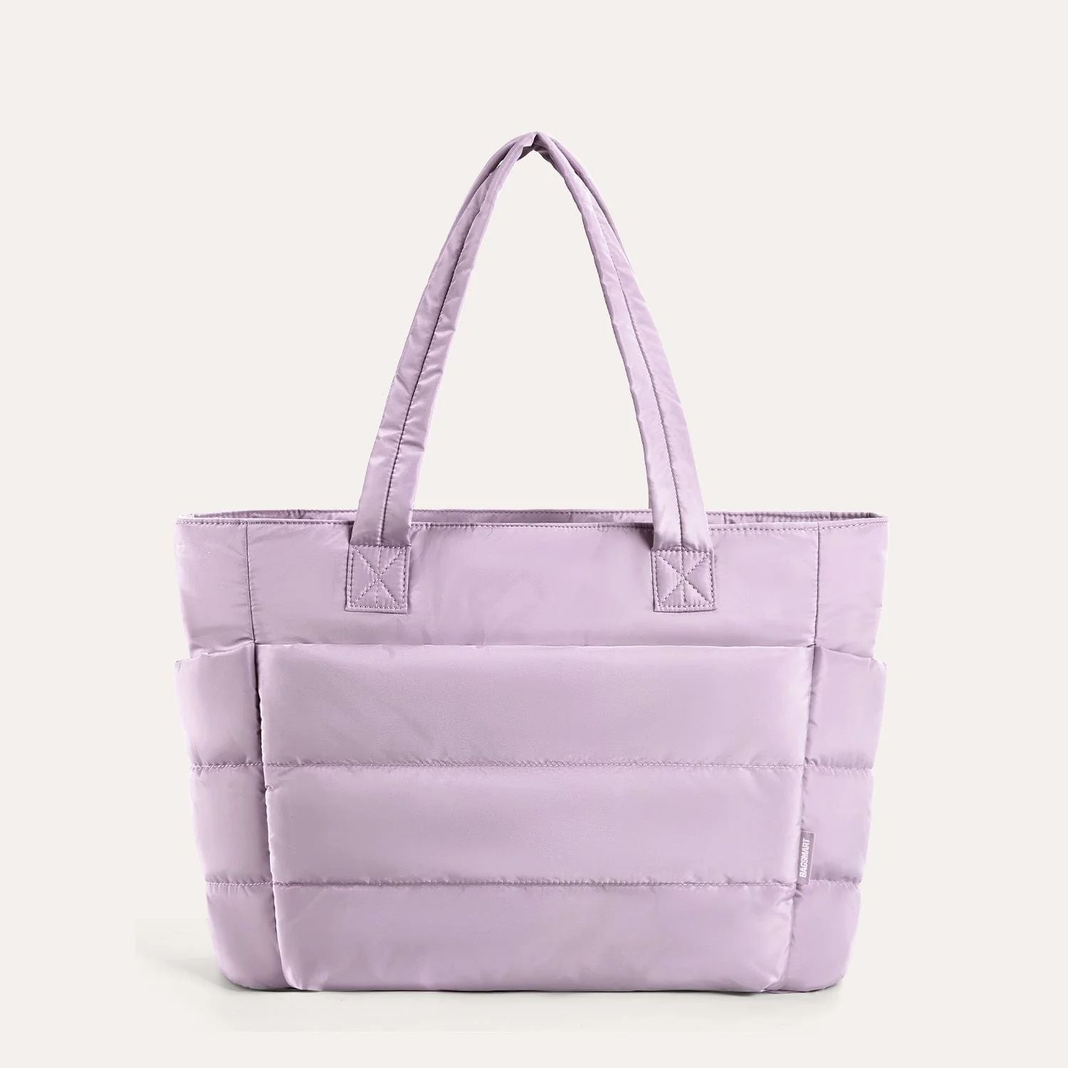 Light purple quilted puffer tote bag, front view on plain background