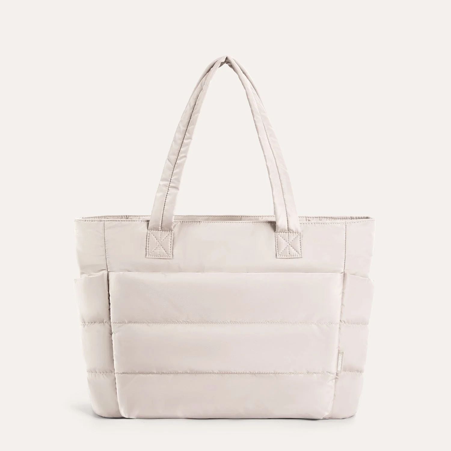 Beige quilted puffer tote bag, front view on plain background