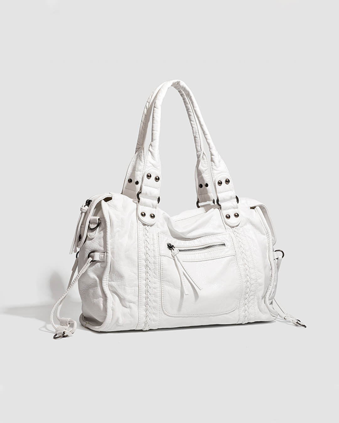 White vintage-style weave bag with braided trim, angled front view