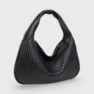 Black woven leather hobo bag, front view on plain background