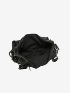 Black vintage-style weave bag open showing interior lining, top-down view