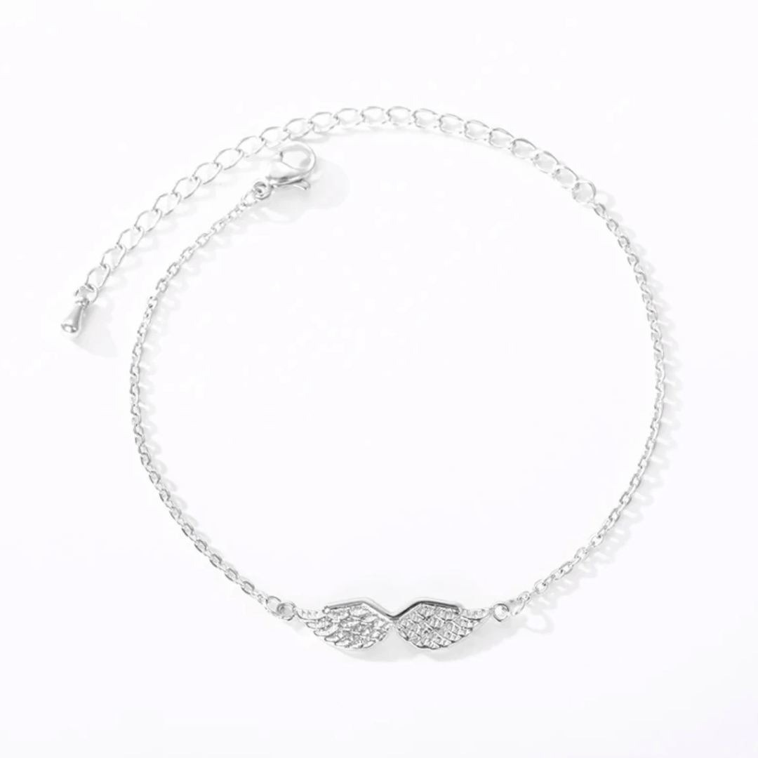 Silver angel wing bracelet, flat lay close-up