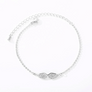 Silver angel wing bracelet, flat lay close-up